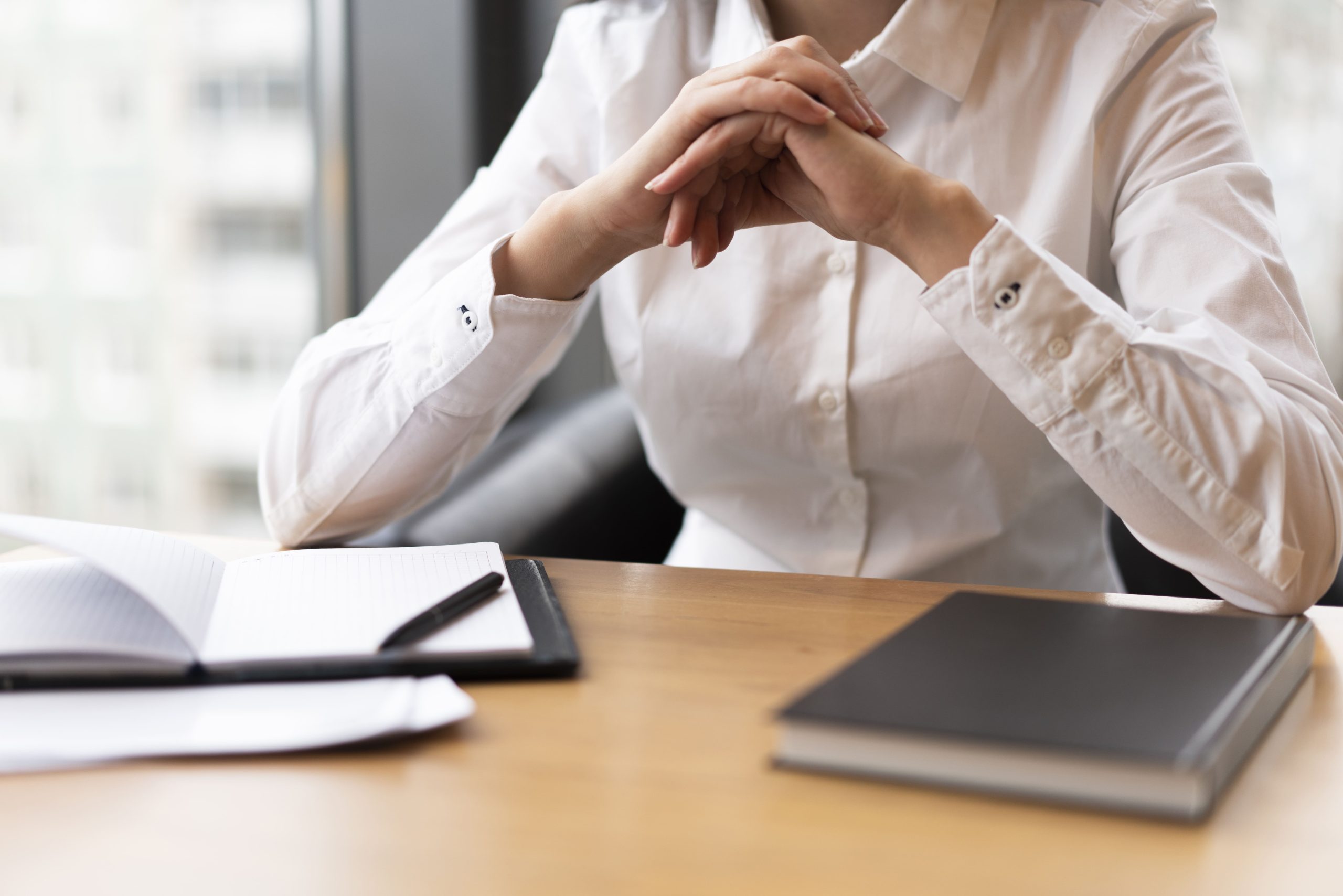 unrecognisable woman thinking office